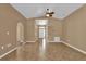 Expansive living room with vaulted ceilings and open layout, showcasing tile flooring at 346 Vista Oaks Way, Davenport, FL 33837