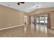 Spacious living room featuring a wall of sliding glass doors for natural light and access to outdoor space at 346 Vista Oaks Way, Davenport, FL 33837