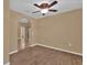 Neutral living room featuring hardwood floors and arched doorway at 346 Vista Oaks Way, Davenport, FL 33837