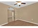 Neutral living room featuring hardwood floors and arched doorway at 346 Vista Oaks Way, Davenport, FL 33837