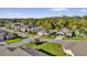 Aerial view of homes on a cul-de-sac featuring well-manicured lawns and mature trees at 346 Vista Oaks Way, Davenport, FL 33837