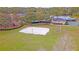 Aerial view of sand volleyball and basketball courts with a community pool at 3734 Safflower Terrace, Oviedo, FL 32766