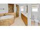 Bathroom featuring bathtub, tiled shower, and double vanity at 3734 Safflower Terrace, Oviedo, FL 32766