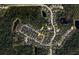 An overhead view of a suburban neighborhood, highlighting a network of residential streets and surrounding natural landscape at 3734 Safflower Terrace, Oviedo, FL 32766