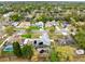 Wide angle aerial view shows home in residential neighborhood with mature trees and nearby amenities at 409 Surrey Run, Casselberry, FL 32707