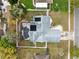 Overhead aerial view of the house highlighting the pool area, solar panels and roof at 409 Surrey Run, Casselberry, FL 32707