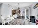 Charming dining area adjacent to the living room and kitchen, creating a perfect space for gatherings at 409 Surrey Run, Casselberry, FL 32707