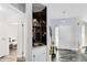 Hallway featuring a bar and a white door, creating an inviting flow to other rooms of the home at 409 Surrey Run, Casselberry, FL 32707