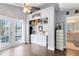 Light and bright main bedroom featuring wood floors, closet and storage areas, and double doors to the lanai at 409 Surrey Run, Casselberry, FL 32707