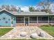 Backyard view featuring a patio, screened in porch, exterior architectural elements and lawn at 418 Norwood Ct, Oviedo, FL 32765