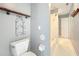 Bathroom featuring a toilet, a decoratively shelved wall, and a shower-tub combination at 418 Norwood Ct, Oviedo, FL 32765