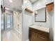 Bathroom featuring a shower-tub combination, a vanity, and a door to the outside at 418 Norwood Ct, Oviedo, FL 32765