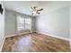 Bedroom featuring wood floors, ceiling fan, and natural light at 418 Norwood Ct, Oviedo, FL 32765