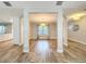 Dining room with gray walls and flooring featuring a stylish chandelier at 418 Norwood Ct, Oviedo, FL 32765