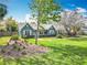 Charming single-story home featuring light blue siding, white trim, well-manicured lawn, and inviting curb appeal at 418 Norwood Ct, Oviedo, FL 32765