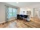 Open kitchen and dining area features granite counters, stainless appliances, and wood flooring at 418 Norwood Ct, Oviedo, FL 32765