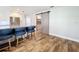 Kitchen with granite countertops, bar stool seating and barn door to the laundry room at 418 Norwood Ct, Oviedo, FL 32765