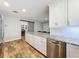 Kitchen featuring granite countertops, stainless steel appliances, and a barn door at 418 Norwood Ct, Oviedo, FL 32765