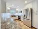 Kitchen featuring stainless steel appliances, white cabinets and granite countertops at 418 Norwood Ct, Oviedo, FL 32765