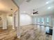 Spacious living room features hardwood floors, recessed lighting, and a ceiling fan with views of the rear exterior at 418 Norwood Ct, Oviedo, FL 32765