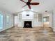 Vaulted ceiling living room featuring a black marble fireplace and custom built-ins at 418 Norwood Ct, Oviedo, FL 32765