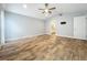 Main bedroom with vaulted ceiling, wood floors, and ensuite bathroom entrance at 418 Norwood Ct, Oviedo, FL 32765