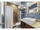 Charming bathroom with a custom vanity, stylish mirror, and walk-in shower with beautiful tile work at 421 Broadway Ave, Orlando, FL 32803