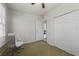 Bright bedroom featuring neutral walls, closet, ceiling fan, and neutral carpet at 421 Broadway Ave, Orlando, FL 32803