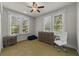 Bedroom with hardwood floors, natural light, and neutral walls and a wooden dresser at 421 Broadway Ave, Orlando, FL 32803