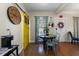 Cozy dining area featuring blue chairs and a rustic round table at 421 Broadway Ave, Orlando, FL 32803