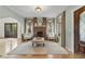 Classic living room with a brick fireplace, light green walls, and lots of natural light at 421 Broadway Ave, Orlando, FL 32803