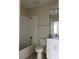 Bathroom featuring a shower-tub combo, toilet, and vanity with a bright mirror at 4724 Tribute Trl, Kissimmee, FL 34746