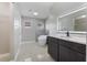 Modern bathroom with a freestanding tub, elegant vanity, and stylish fixtures, creating a spa-like atmosphere at 4909 Fiske Cir, Orlando, FL 32826