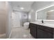 Modern bathroom with a freestanding tub, elegant vanity, and stylish fixtures, creating a spa-like atmosphere at 4909 Fiske Cir, Orlando, FL 32826