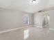 An empty bedroom with neutral paint, modern floor tile, a new window and ample natural light at 4909 Fiske Cir, Orlando, FL 32826