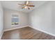 Bedroom with a ceiling fan, and window overlooking the backyard at 4909 Fiske Cir, Orlando, FL 32826