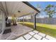 Covered patio with outdoor seating and backyard view at 4909 Fiske Cir, Orlando, FL 32826