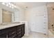 Bright bathroom featuring a double vanity with granite countertop and a shower/tub combo at 5025 Walker St, St Cloud, FL 34771