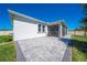 Paver patio and screened porch enhance the outdoor living space of this lovely home at 5301 Amersham Ln, St Cloud, FL 34771