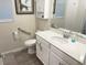 Clean bathroom features a white vanity with quartz countertop and a walk-in shower at 5301 Amersham Ln, St Cloud, FL 34771