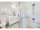 Bathroom with a glass-enclosed shower, white cabinetry, and modern fixtures at 5301 Amersham Ln, St Cloud, FL 34771