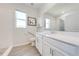 Well-lit bathroom featuring white cabinetry, quartz countertop, and a walk-in shower at 5301 Amersham Ln, St Cloud, FL 34771