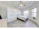 Serene bedroom with bright neutral tones, modern furniture and a large window at 5301 Amersham Ln, St Cloud, FL 34771