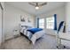 Bright bedroom featuring a ceiling fan, natural lighting, and neutral decor at 5301 Amersham Ln, St Cloud, FL 34771