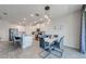 Cozy dining area with modern lighting, seamlessly connected to a stylish, contemporary kitchen at 5301 Amersham Ln, St Cloud, FL 34771