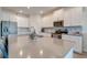 Modern kitchen with a large island and stainless steel appliances that offers a sleek and functional design at 5301 Amersham Ln, St Cloud, FL 34771