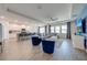 Open concept living room with light wood floors, bright blue accent wall, and an open floor plan at 5301 Amersham Ln, St Cloud, FL 34771