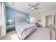 Comfortable main bedroom with ceiling fan, accent wall, and ample natural light at 5301 Amersham Ln, St Cloud, FL 34771