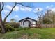 Exterior of home with a backyard featuring a wood deck perfect for relaxation and entertaining at 5990 Hibiscus Rd, Orlando, FL 32807