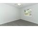 Clean empty bedroom with a white walls, vinyl flooring, ceiling fan, and window at 6222 Fox Hunt Trl, Orlando, FL 32808